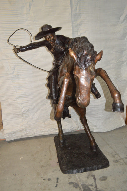 Bronco Buster Giant Bronze Statue -  Size: 65"L x 52"W x 64"H.