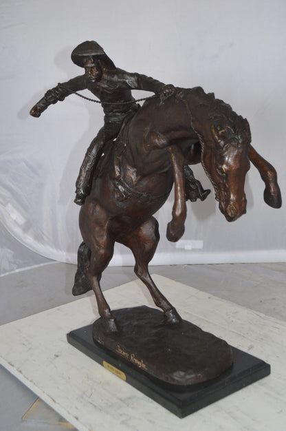 Wooly Chaps Bronze Statue by Remington -  Size: 19"L x 11"W x 23"H. 
