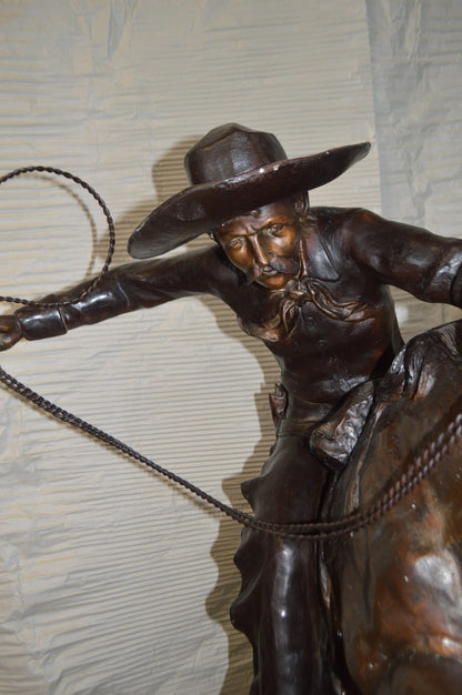 Bronco Buster Giant Bronze Statue -  Size: 65"L x 52"W x 64"H.