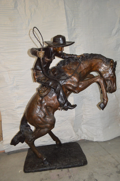 Bronco Buster Giant Bronze Statue -  Size: 65"L x 52"W x 64"H.