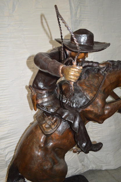 Bronco Buster Giant Bronze Statue -  Size: 65"L x 52"W x 64"H.