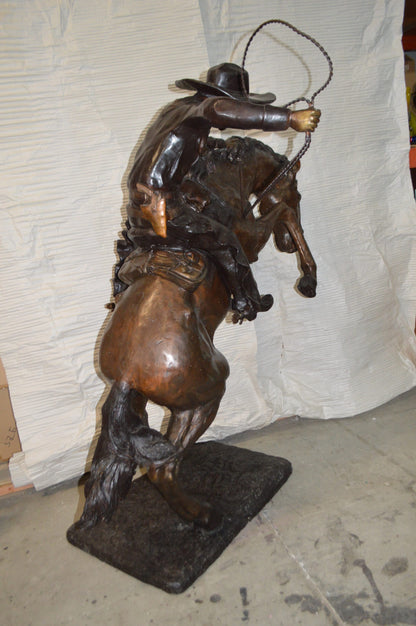 Bronco Buster Giant Bronze Statue -  Size: 65"L x 52"W x 64"H.