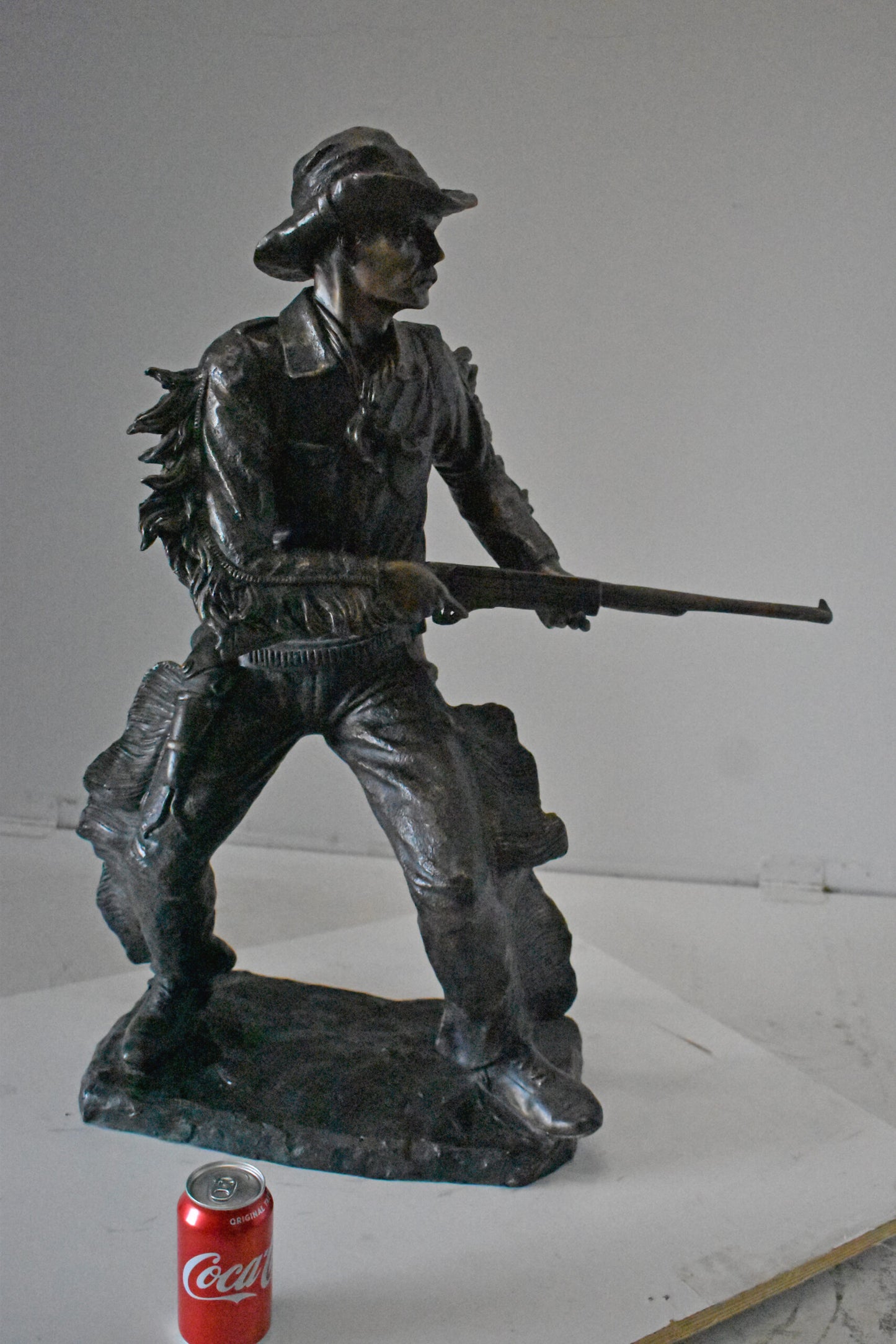 Cowboy with His Gun Bronze Statue - Size: 26"L x 13"W x 33"H.