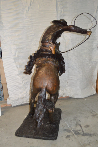 Bronco Buster Giant Bronze Statue -  Size: 65"L x 52"W x 64"H.