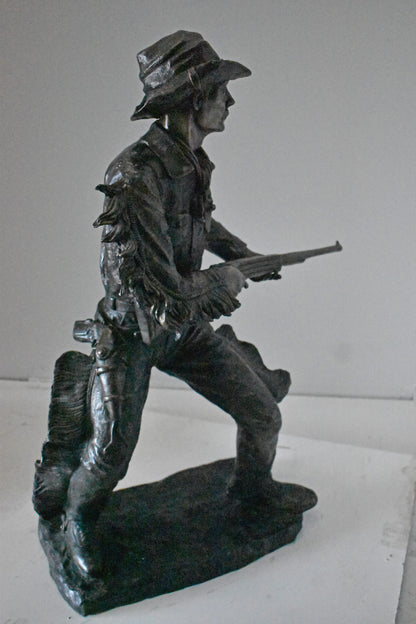 Cowboy with His Gun Bronze Statue - Size: 26"L x 13"W x 33"H.