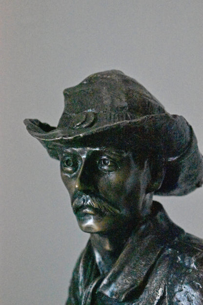 Cowboy with His Gun Bronze Statue - Size: 26"L x 13"W x 33"H.