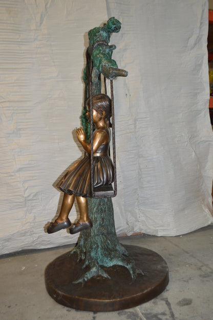 Girl on Swing 65 Bronze Statue -  Size: 44"L x 35"W x 65"H.