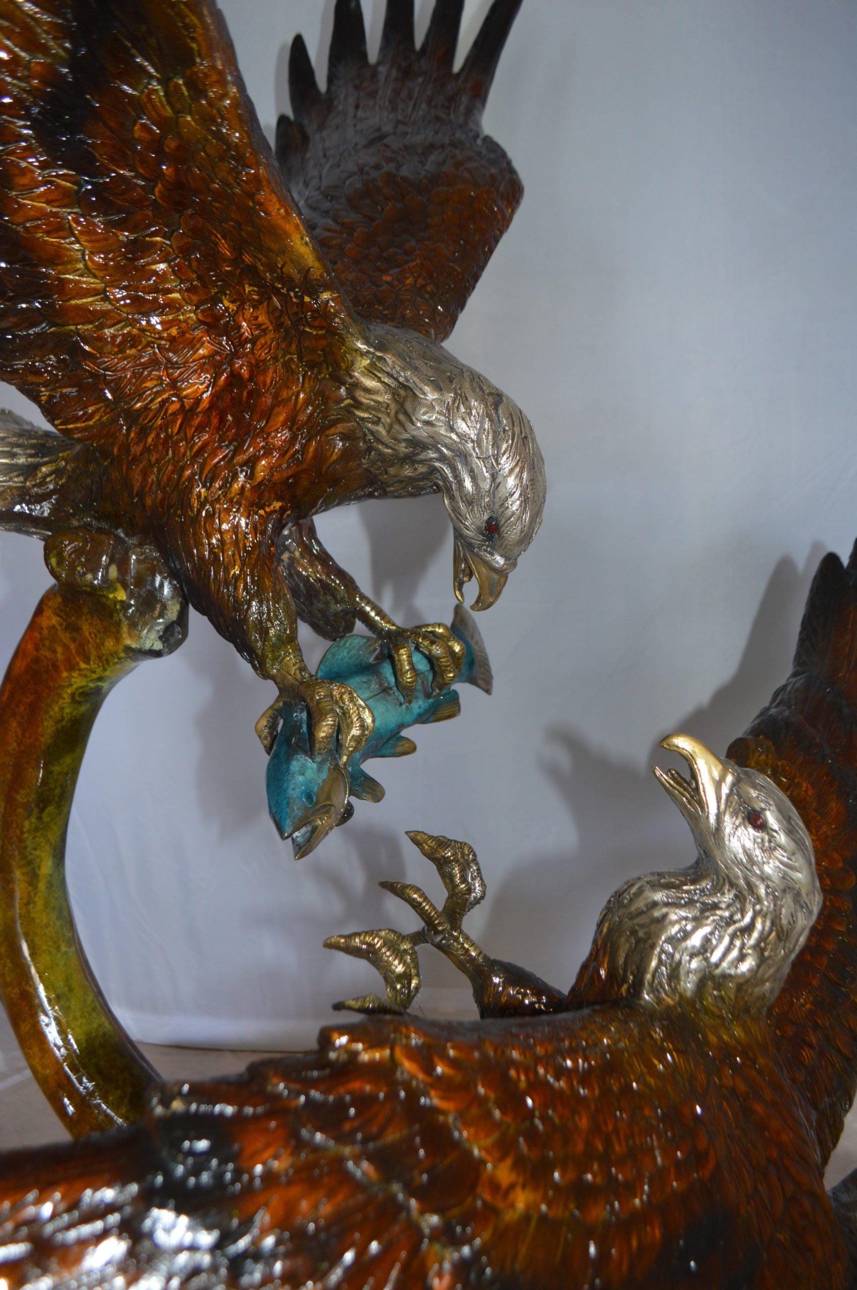 Two Eagles Fighting on Fish Bronze Statue -  Size: 33"L x 28"W x 42"H. 