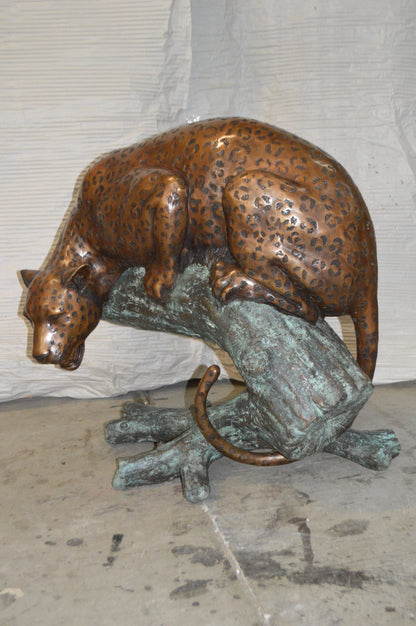 Leopard on a Tree Trunk Bronze Statue -  Size: 38"L x 34"W x 36"H.