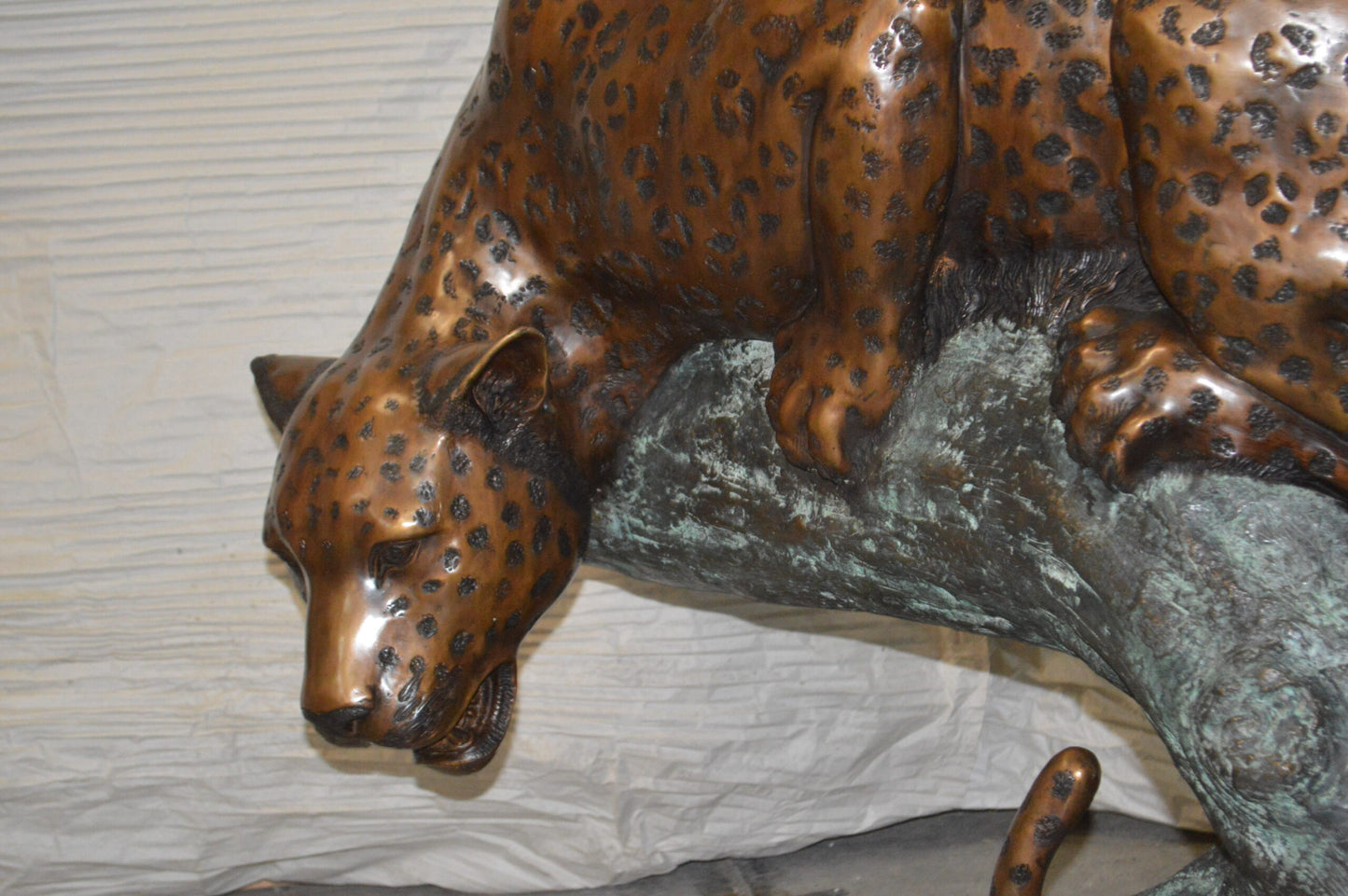 Leopard on a Tree Trunk Bronze Statue -  Size: 38"L x 34"W x 36"H.