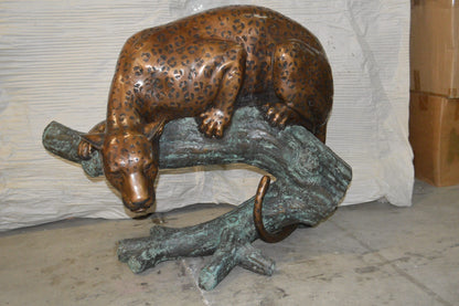 Leopard on a Tree Trunk Bronze Statue -  Size: 38"L x 34"W x 36"H.