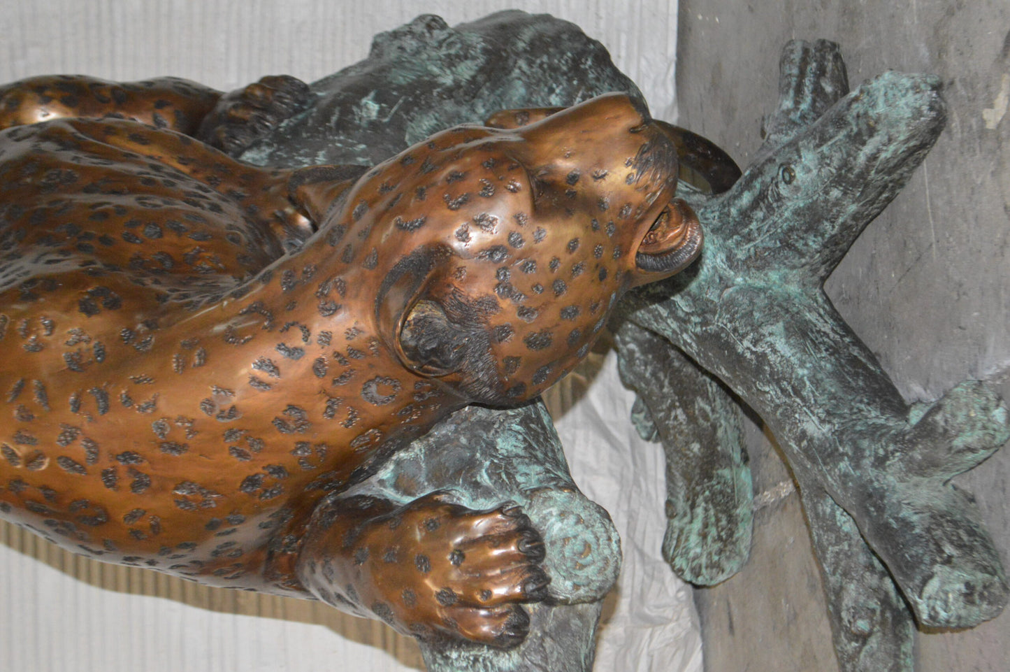 Leopard on a Tree Trunk Bronze Statue -  Size: 38"L x 34"W x 36"H.