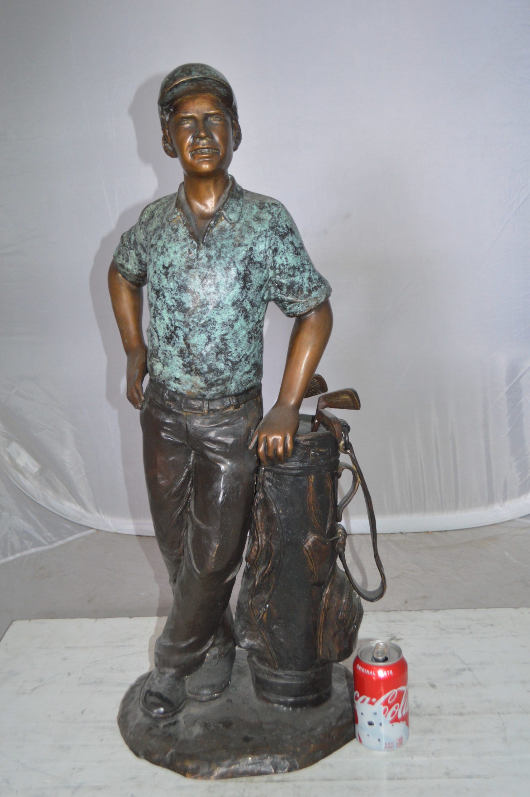 Golfer with bag Bronze Statue -  Size: 12"L x 13"W x 32"H. 