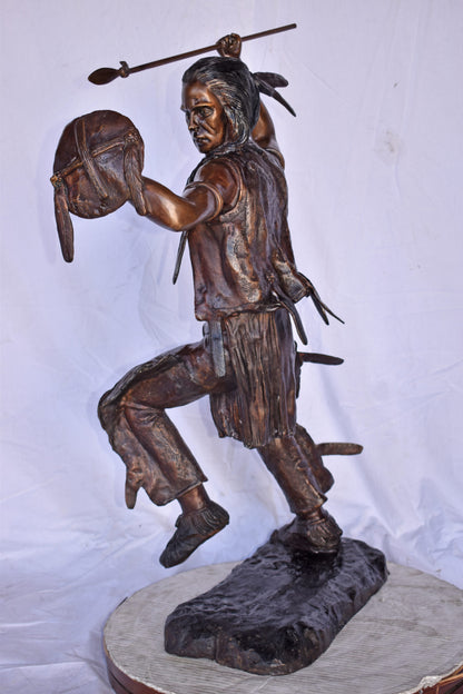 Indian Worrier Throwing a Spear Bronze Statue - Size: 15"L x 23"W x 38"H.