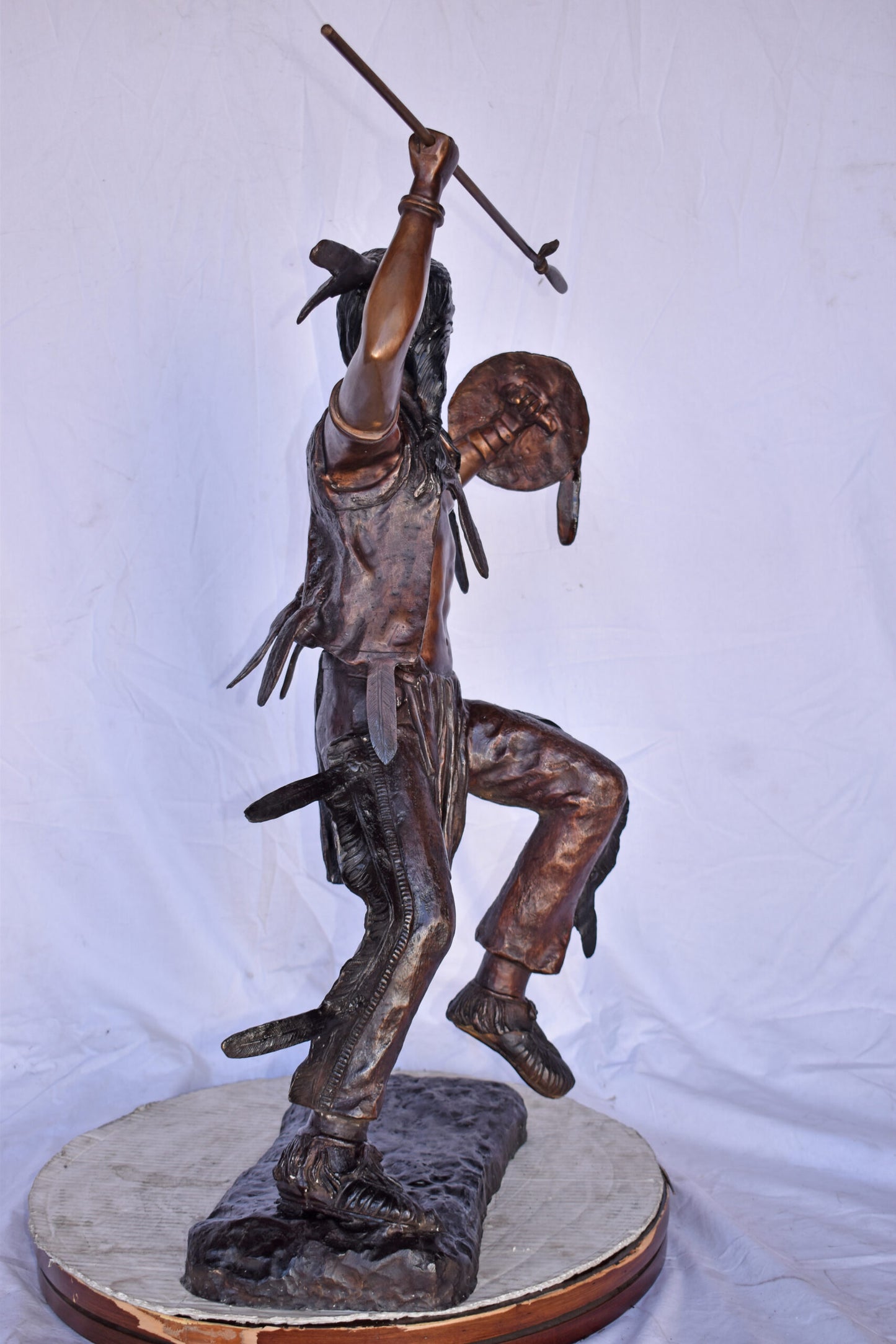 Indian Worrier Throwing a Spear Bronze Statue - Size: 15"L x 23"W x 38"H.
