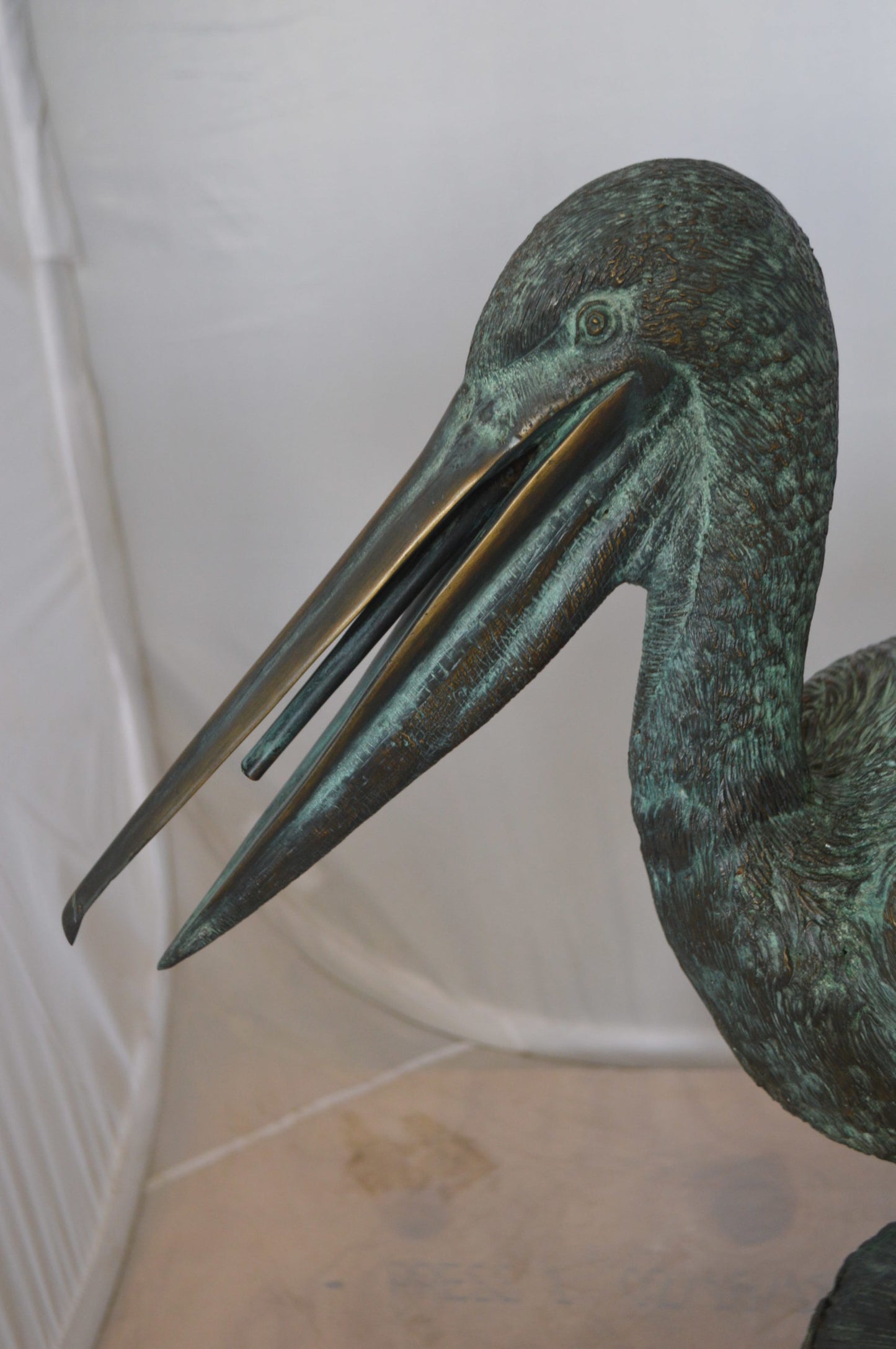 Pelican on a Tree Stump fountain bronze statue -  Size: 30"L x 16"W x 46"H. 