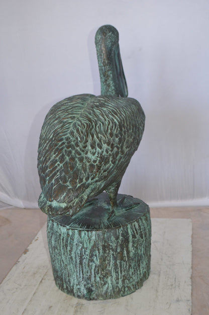 Pelican on a Tree Stump fountain bronze statue -  Size: 30"L x 16"W x 46"H. 