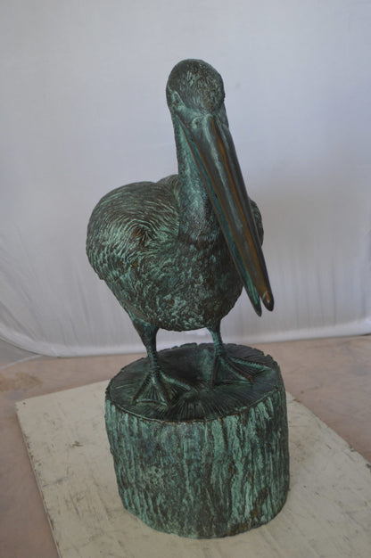 Pelican on a Tree Stump fountain bronze statue -  Size: 30"L x 16"W x 46"H. 