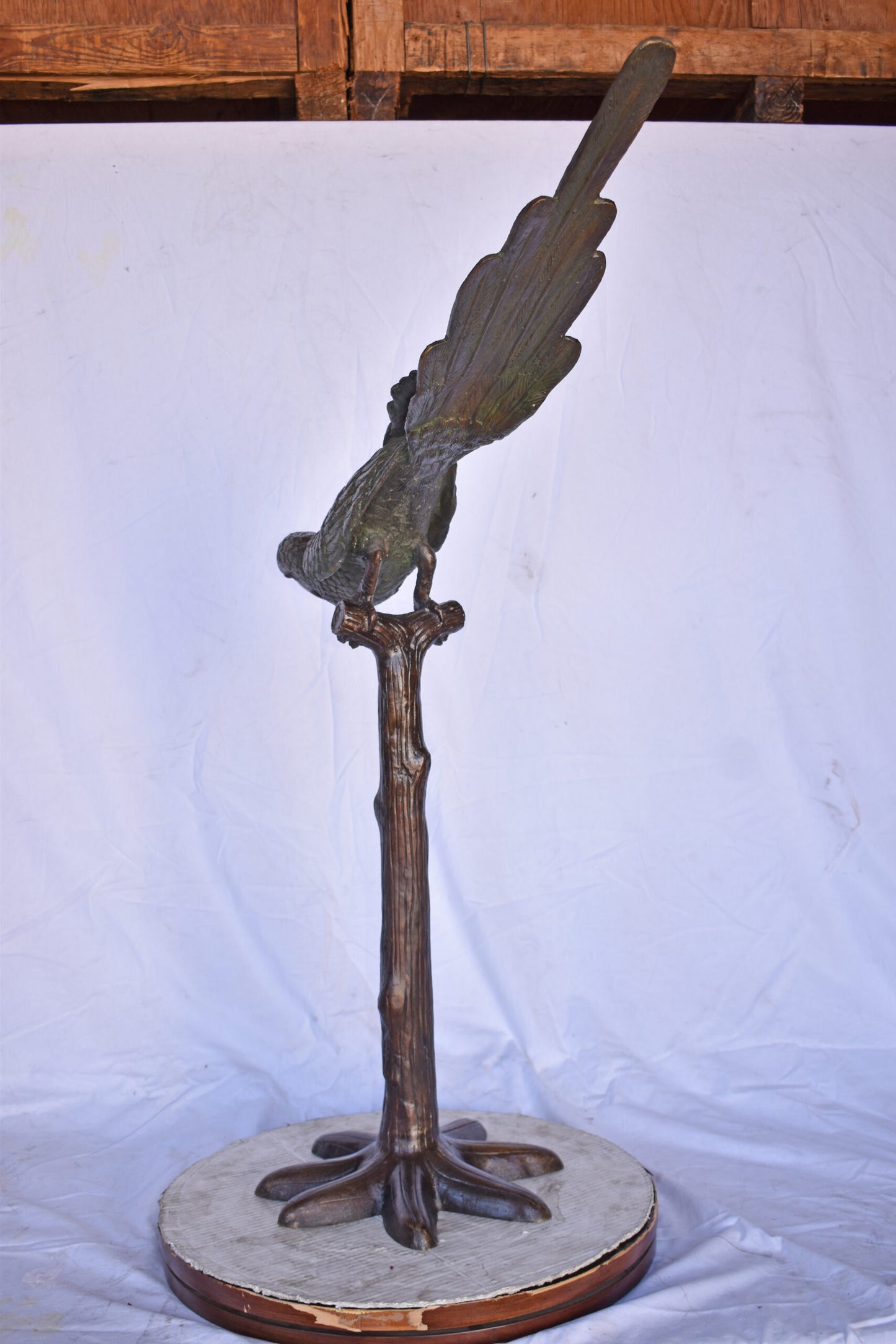 Parrot on a Tree looking Down Bronze Statue - Size: 37"L x 15"W x 47"H.
