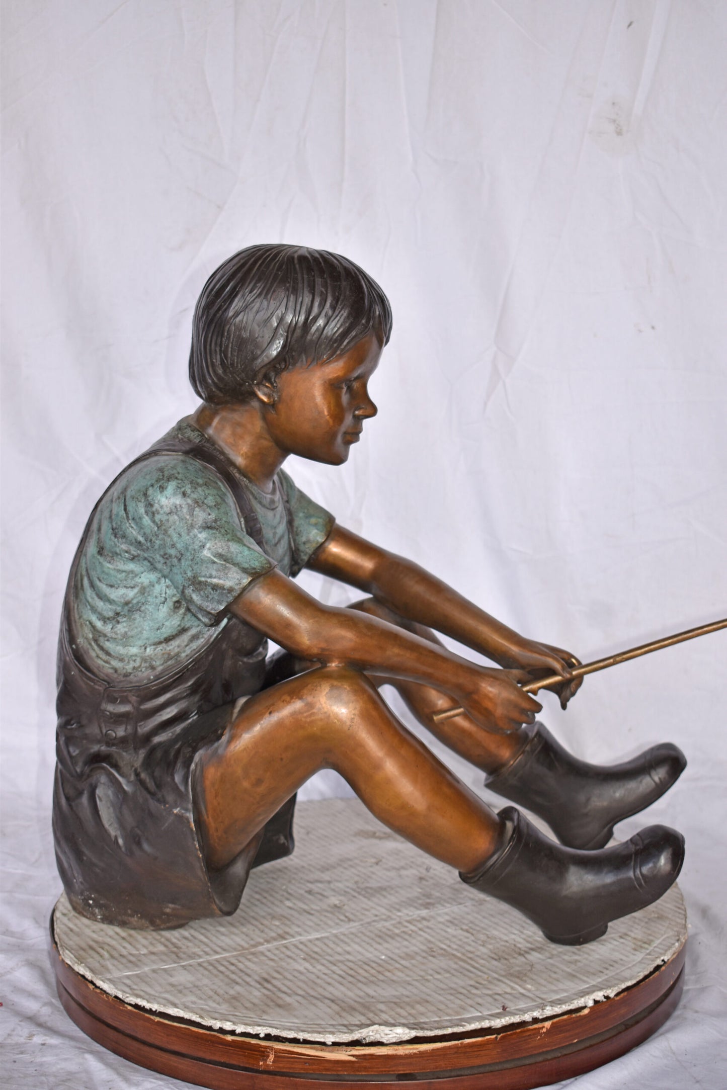 Boy Sitting on the Ground, Fishing Bronze Statue - Size: 26"L x 15"W x 25"H.
