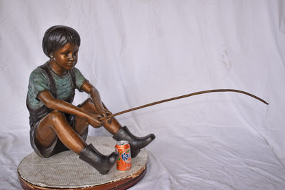 Boy Sitting on the Ground, Fishing Bronze Statue - Size: 26"L x 15"W x 25"H.