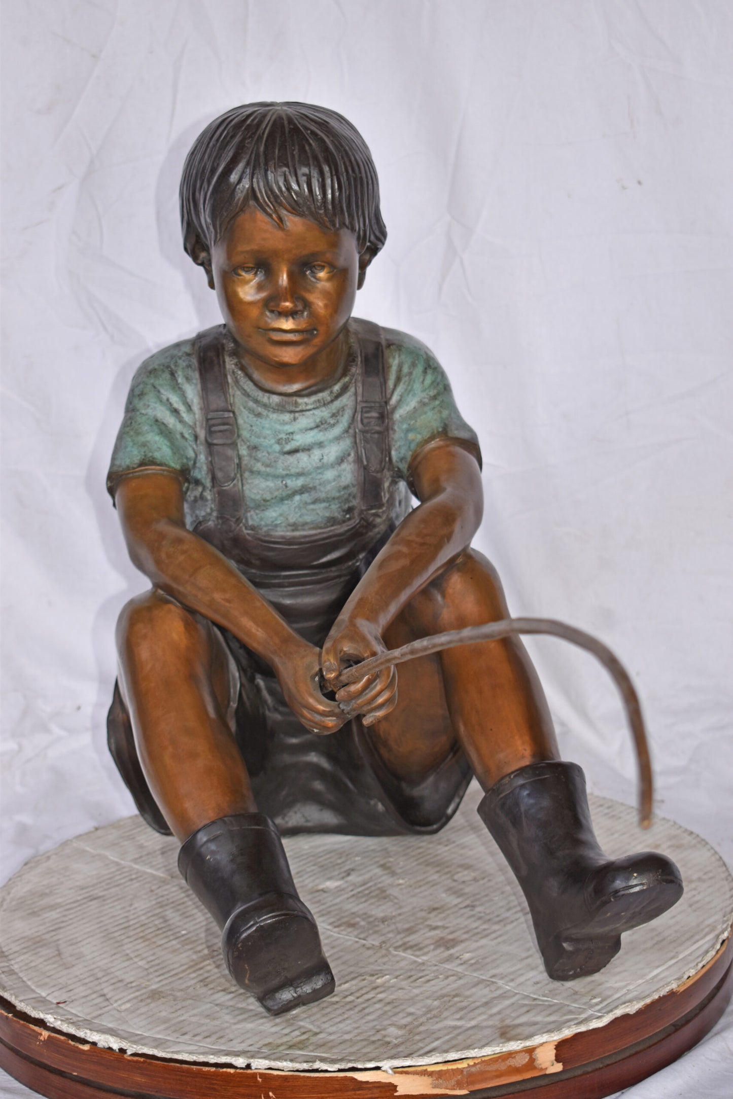 Boy Sitting on the Ground, Fishing Bronze Statue - Size: 26"L x 15"W x 25"H.