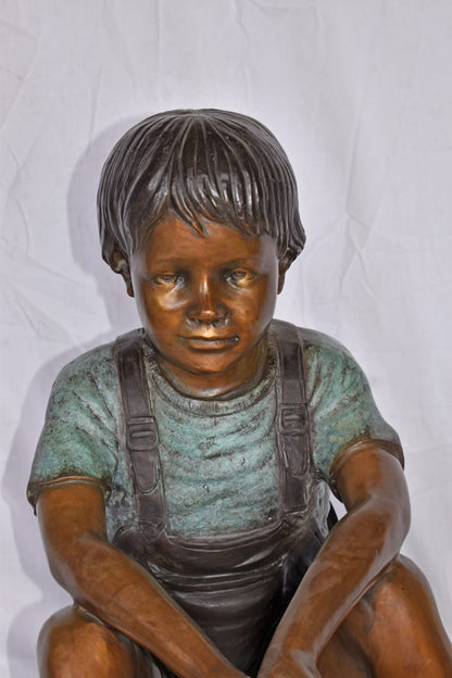 Boy Sitting on the Ground, Fishing Bronze Statue - Size: 26"L x 15"W x 25"H.