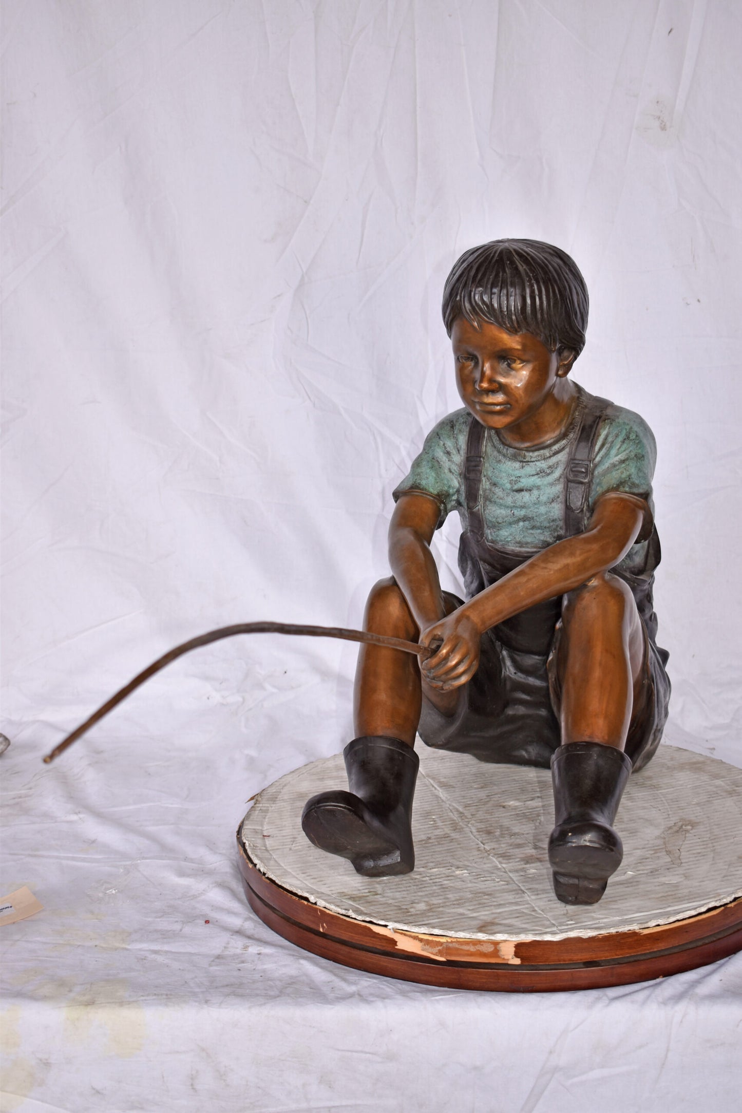 Boy Sitting on the Ground, Fishing Bronze Statue - Size: 26"L x 15"W x 25"H.