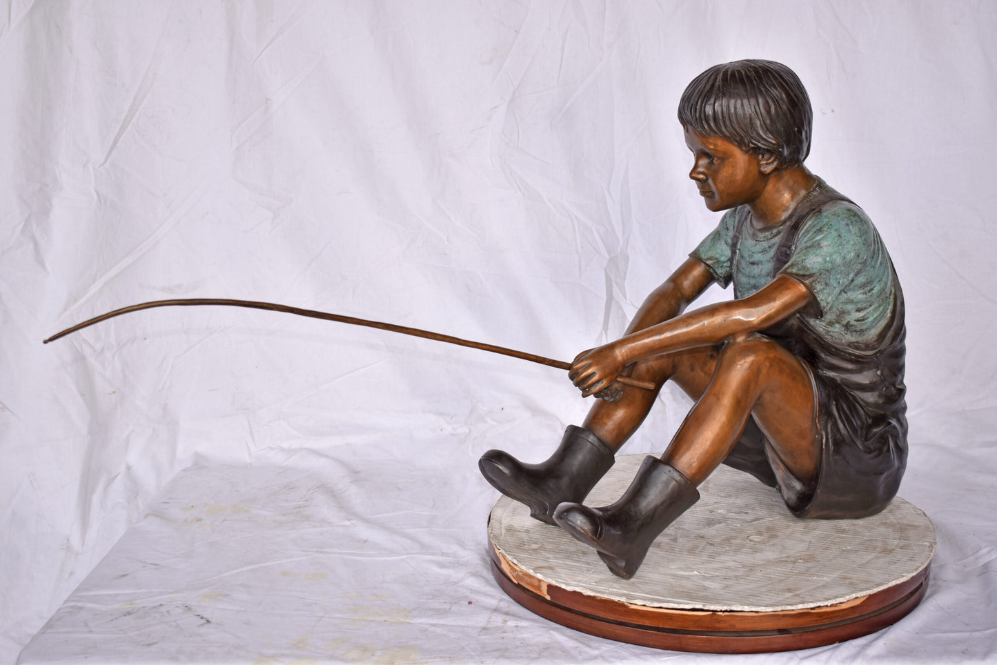 Boy Sitting on the Ground, Fishing Bronze Statue - Size: 26"L x 15"W x 25"H.