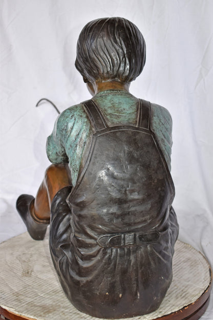 Boy Sitting on the Ground, Fishing Bronze Statue - Size: 26"L x 15"W x 25"H.