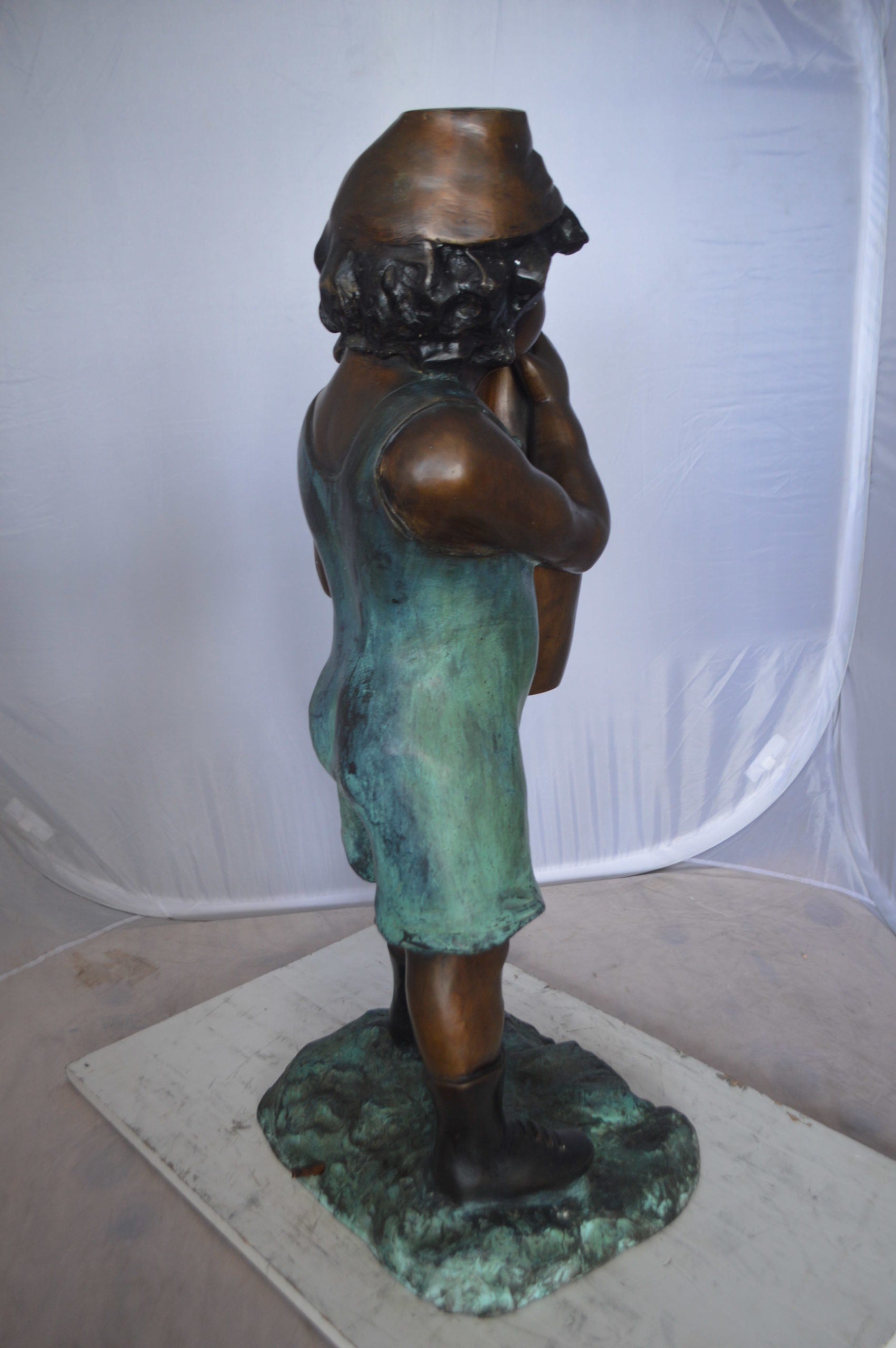 Boy holding a bottle water fountain -  Size: 17"L x 14"W x 38"H. 