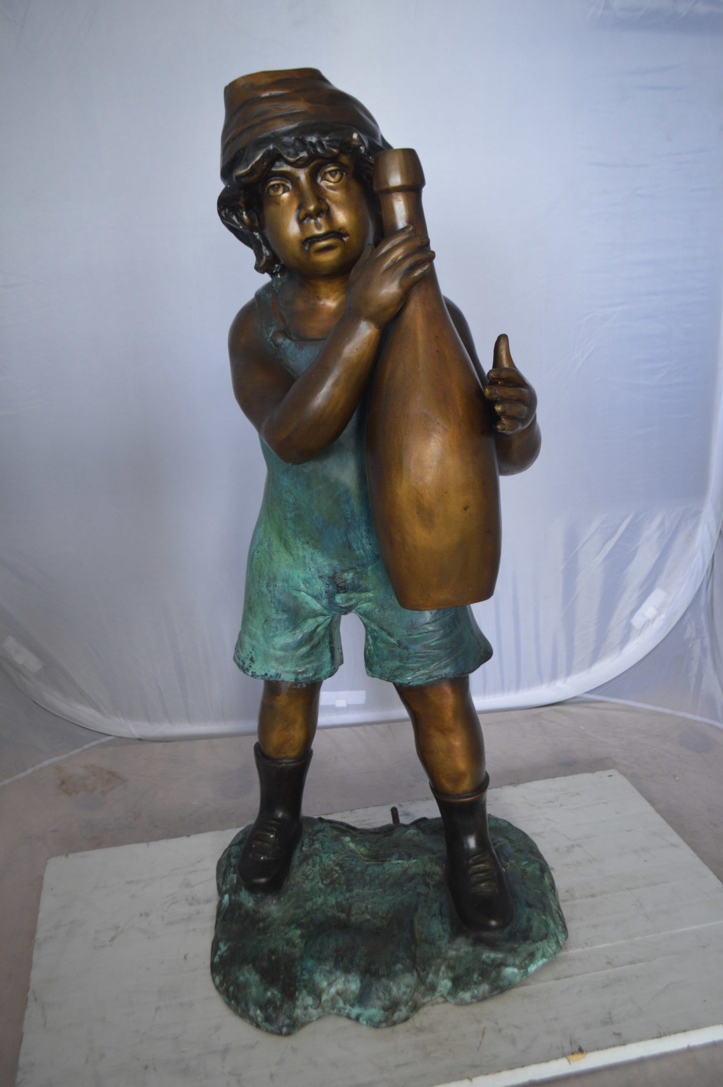 Boy holding a bottle water fountain -  Size: 17"L x 14"W x 38"H. 