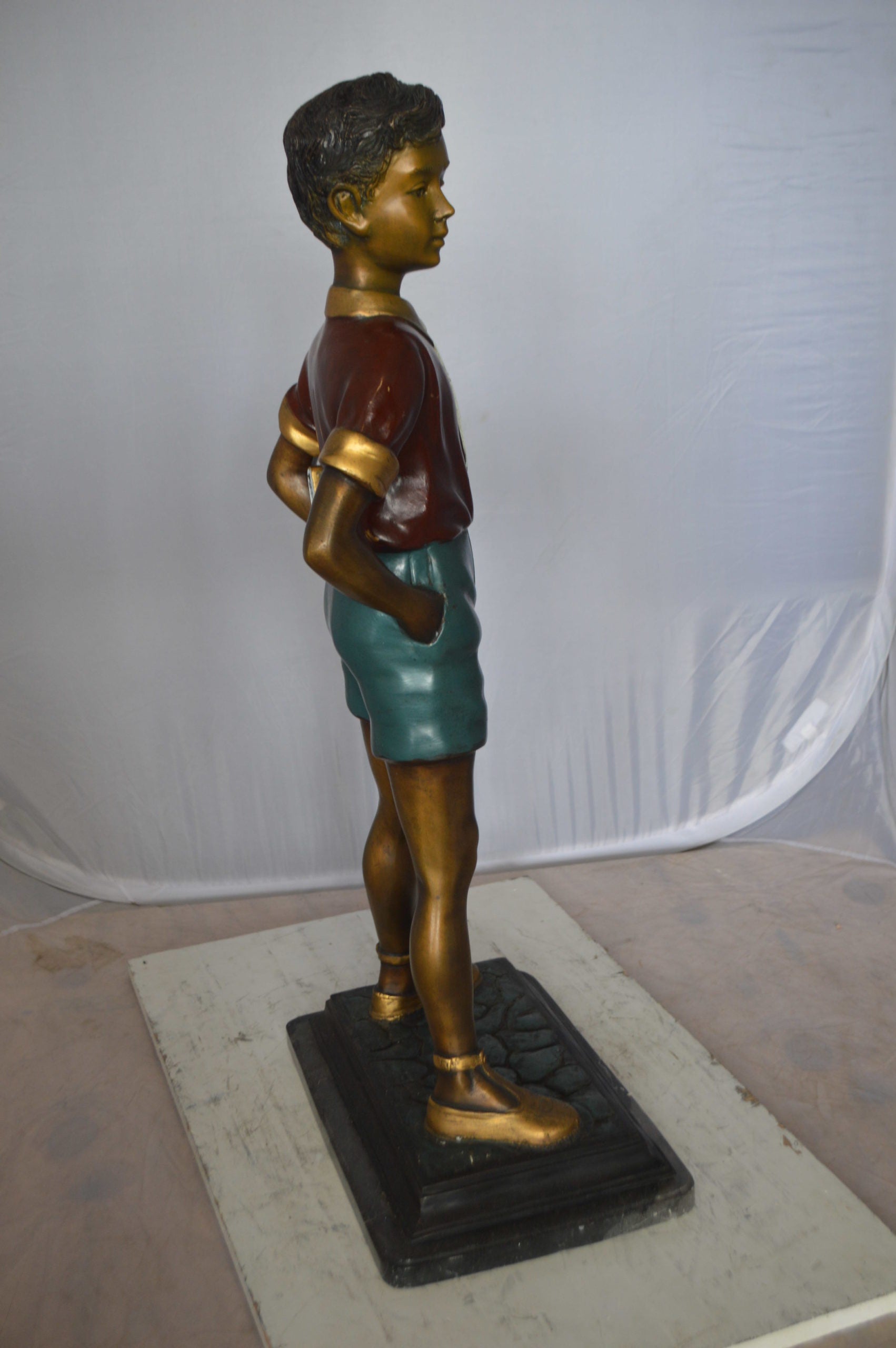 Kid Holding a Book Bronze Statue -  Size: 18"L x 11"W x 36"H. 