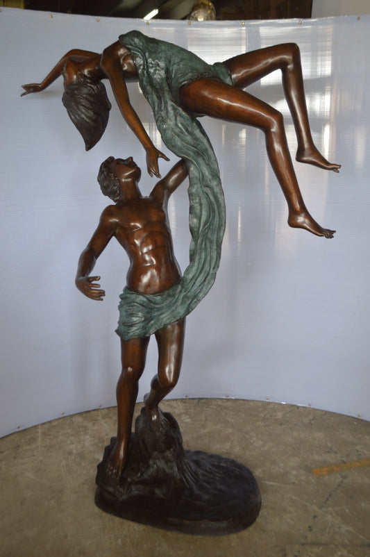 Ballet Man raising Lady Bronze Statue -  Size: 54"L x 33"W x 69"H.