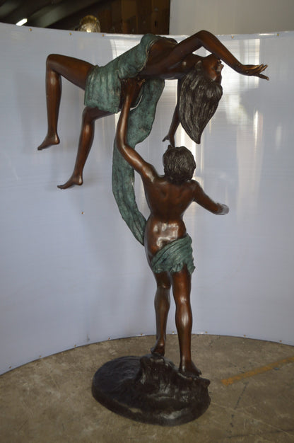 Ballet Man raising Lady Bronze Statue -  Size: 54"L x 33"W x 69"H.