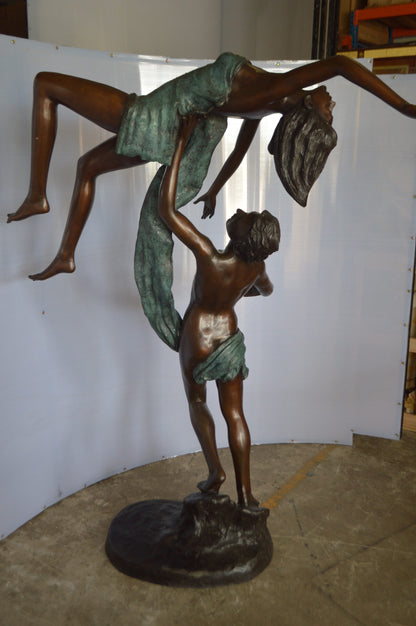 Ballet Man raising Lady Bronze Statue -  Size: 54"L x 33"W x 69"H.
