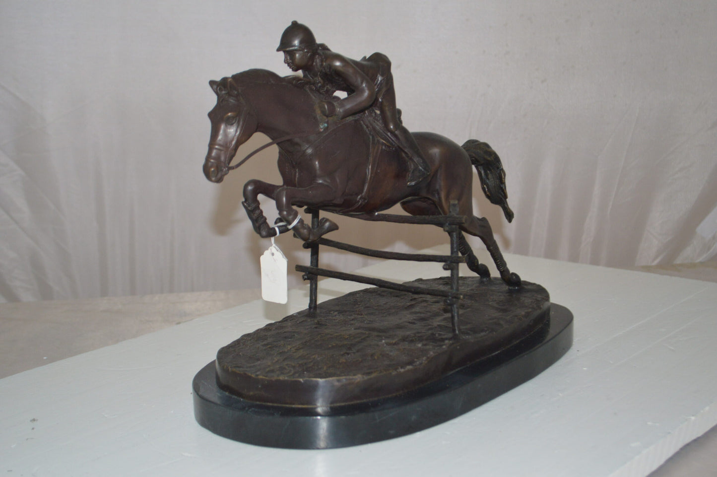 Jockey With Horse Jumping Over Hurdle Bronze Statue -  Size: 14"L x 9"W x 13"H.