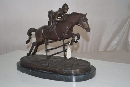 Jockey With Horse Jumping Over Hurdle Bronze Statue -  Size: 14"L x 9"W x 13"H.