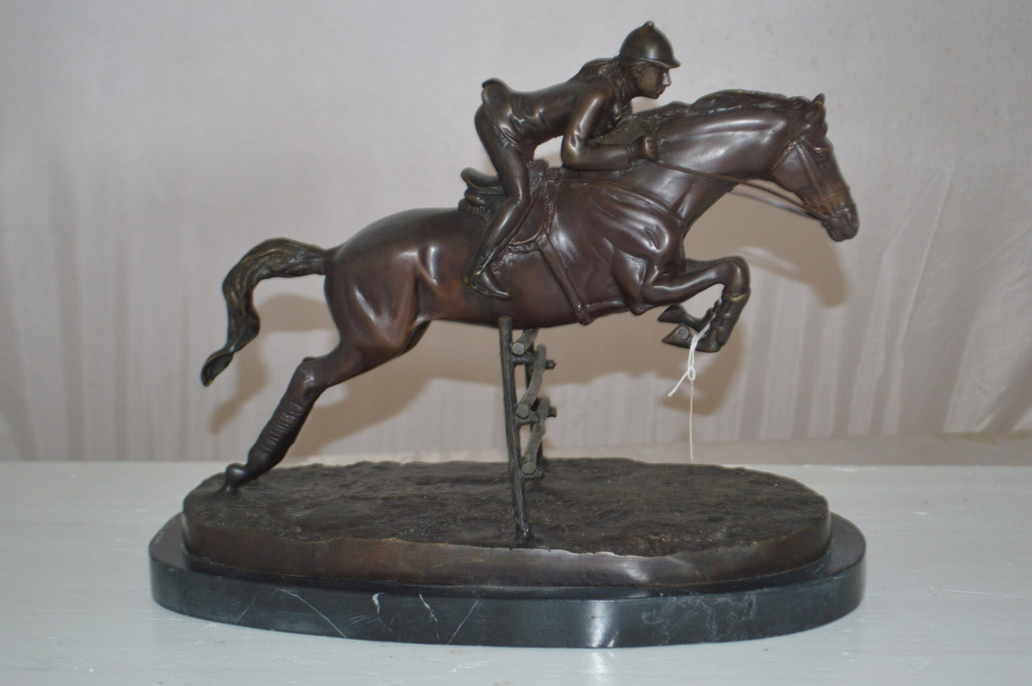 Jockey With Horse Jumping Over Hurdle Bronze Statue -  Size: 14"L x 9"W x 13"H.