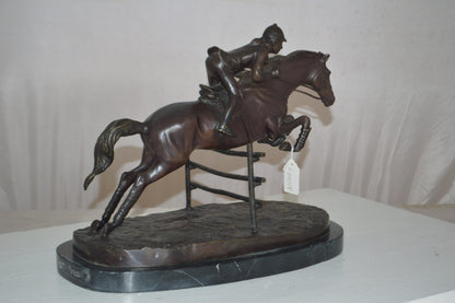 Jockey With Horse Jumping Over Hurdle Bronze Statue -  Size: 14"L x 9"W x 13"H.