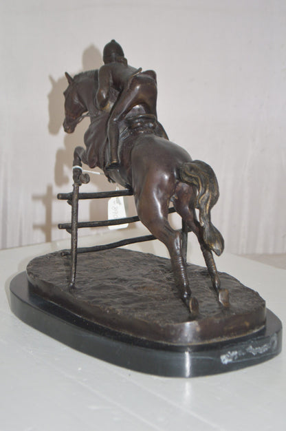 Jockey With Horse Jumping Over Hurdle Bronze Statue -  Size: 14"L x 9"W x 13"H.