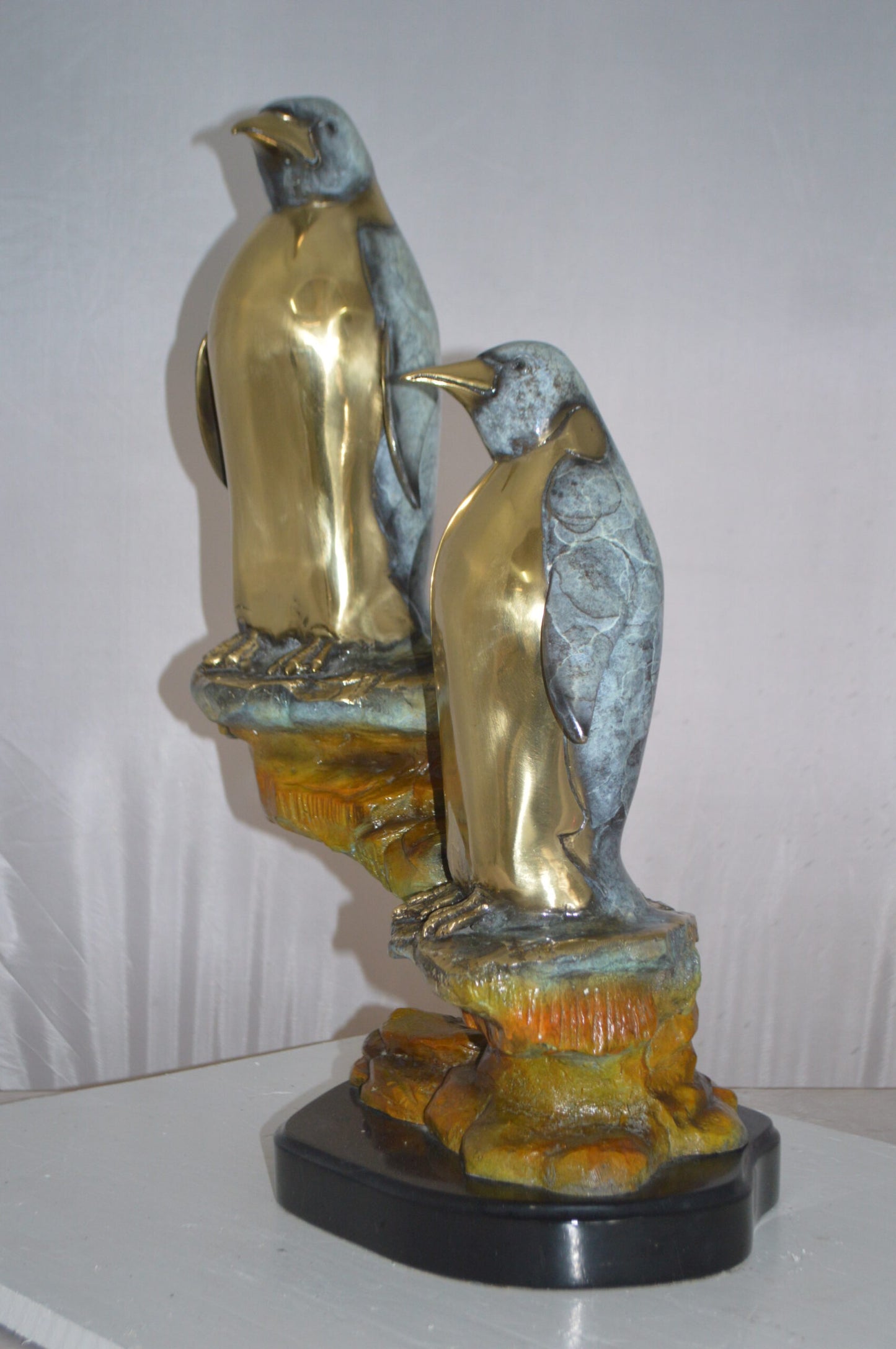 Two Penguins Bronze Statue -  Size: 16"L x 10"W x 12"H.