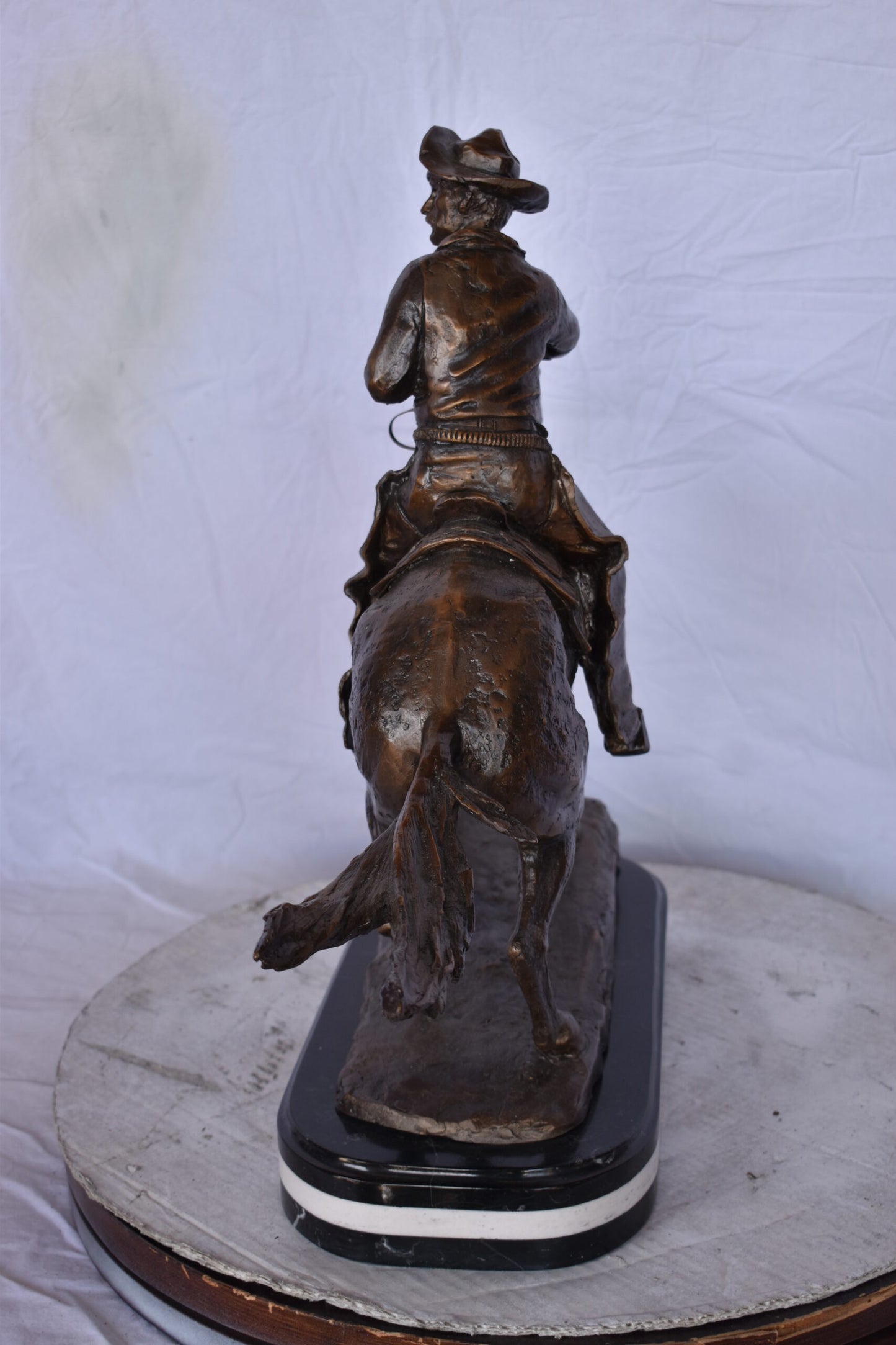 Remington Cowboy Replica Bronze Statue on Triple Marble - Size: 8"x 26"x 23"H.