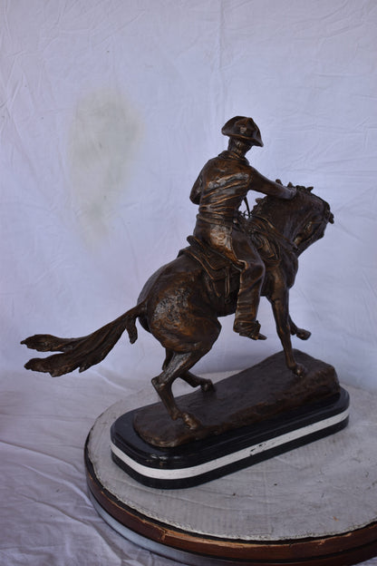 Remington Cowboy Replica Bronze Statue on Triple Marble - Size: 8"x 26"x 23"H.