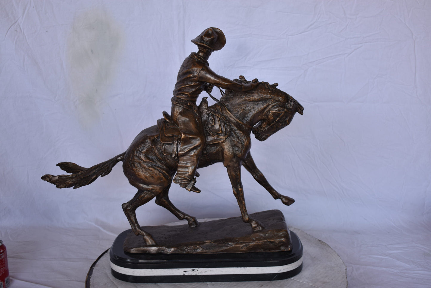 Remington Cowboy Replica Bronze Statue on Triple Marble - Size: 8"x 26"x 23"H.