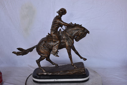 Remington Cowboy Replica Bronze Statue on Triple Marble - Size: 8"x 26"x 23"H.