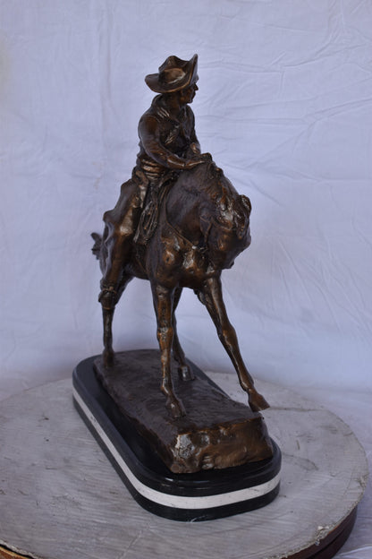 Remington Cowboy Replica Bronze Statue on Triple Marble - Size: 8"x 26"x 23"H.