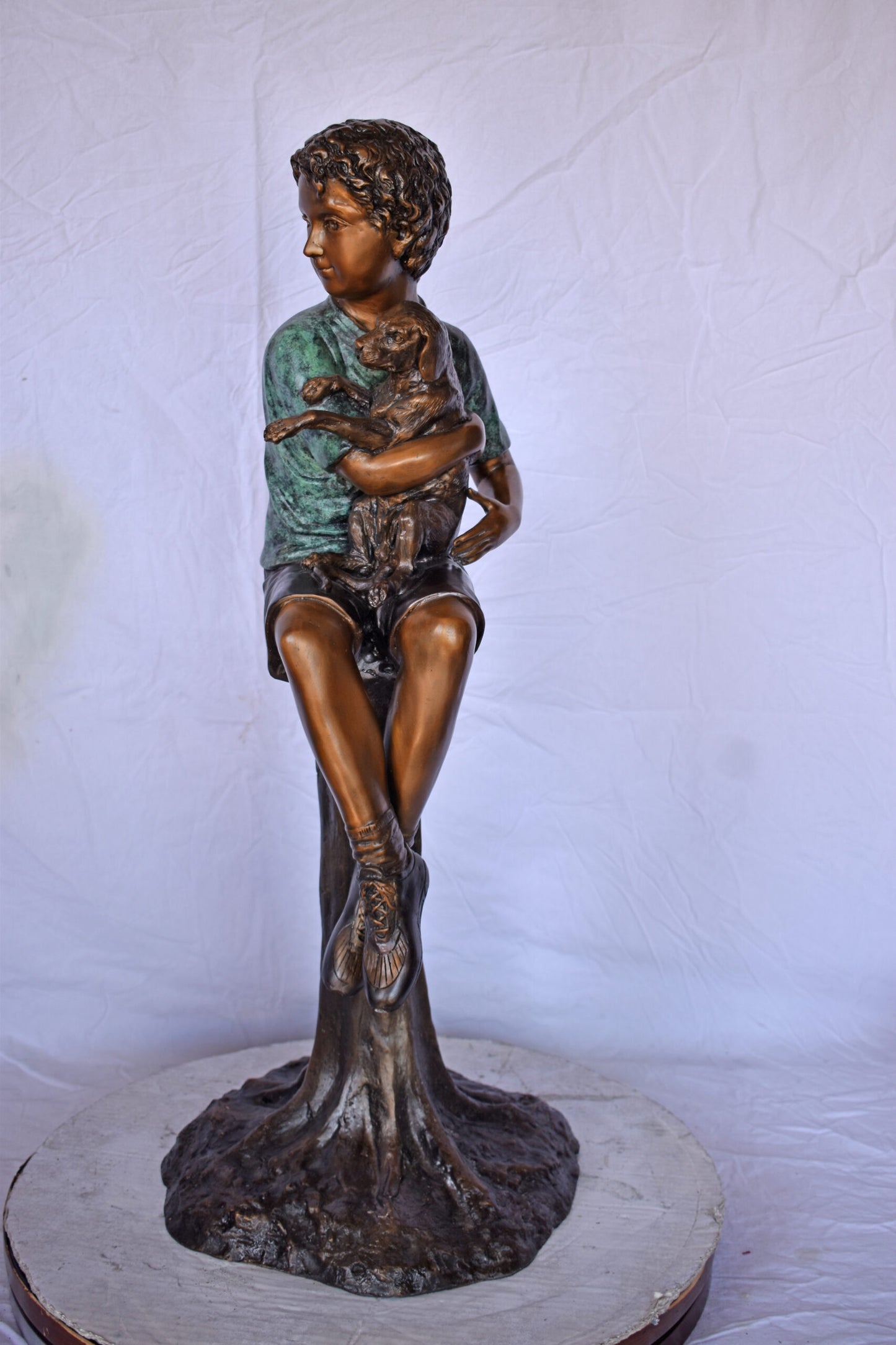 Boy Sitting on A Log with His Puppy Bronze Statue - Size: 15"L x 15"W x 35"H.