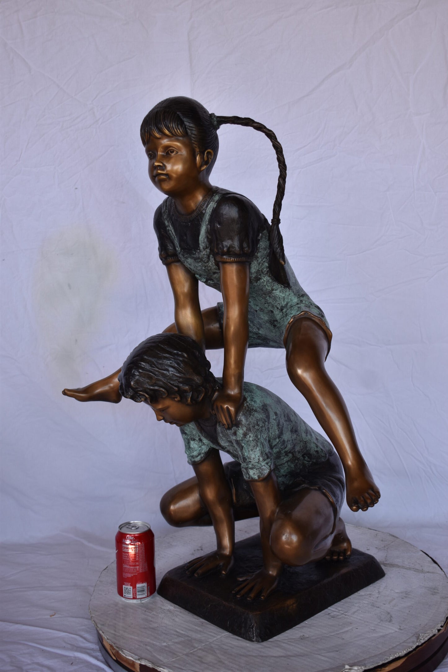 Boy and Girl Leapfrog Jumping Bronze Statue - Size: 25"L x 20"W x 32"H.