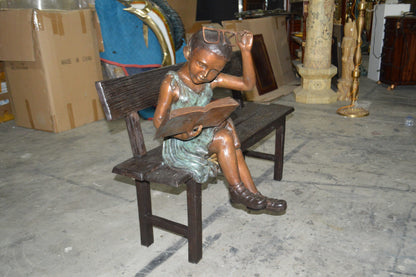 Girl with Glasses on Bench  Bronze Statue -  Size: 43"L x 20"W x 36"H.